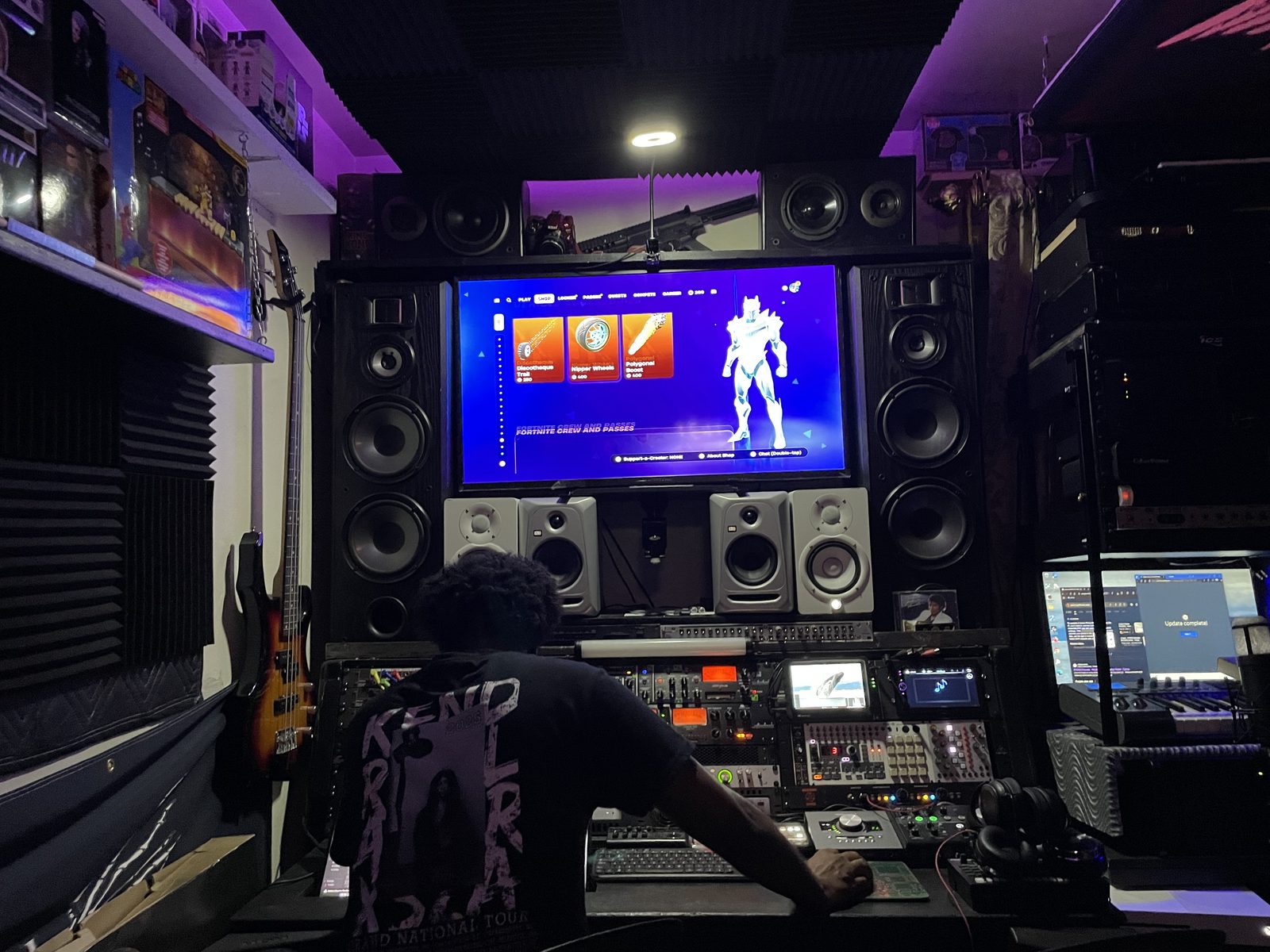 Working at the desk under purple studio lighting