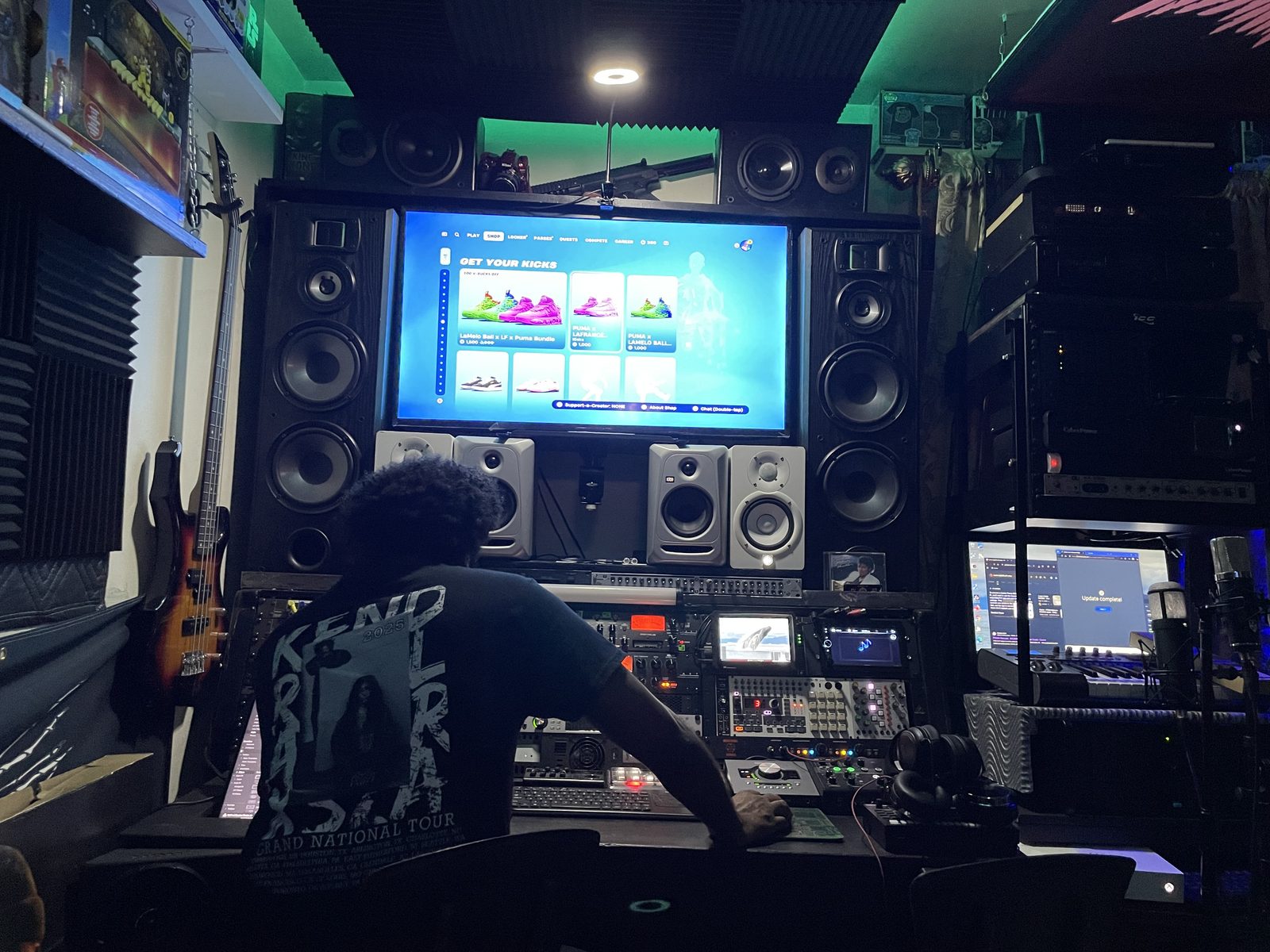 Working at the desk under green studio lighting