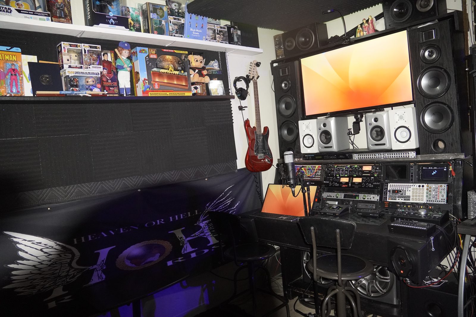 Studio monitor wall under warm lighting