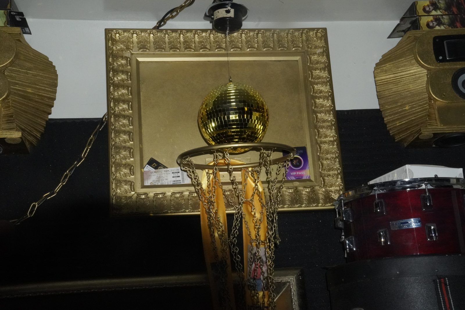 Gold disco ball and trophy decor above the studio